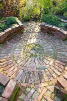 Circular brick patio in herb garden 