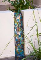 Water feature - mosaic chute with ivory coloured rendered walls