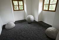 Large stone sculptures inside garden room