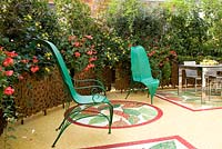 Anna Maria Bernardini de' Pace terrace with chairs by Dilmos, mosaic floor by Pietre e Colori, planters by Andrea Salvetti - Milan, Italy