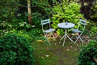 Shady seating area with table and chairs, Aulden Farm