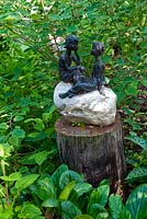 Figurine of boy and girl in woodland garden, Aulden Farm
