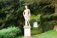 Statue of Apollo with the Long Walk stretching behind, part of Charles Bridgeman's original garden scheme - Rousham House, Bicester, Oxon, UK