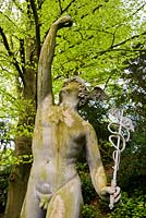 Statue of Mercury sited in a semicircular glade once Charles Bridgeman's turf amphitheatre - Rousham House, Bicester, Oxon, UK