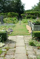 A sundial and plants for sale at the Bellflower Nursery in the walled Garden at Langham Hall in Suffolk, home to The National Collection of Alpine Campanulas 