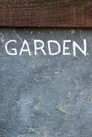 Garden sign on a wall  at the Lost gardens of Heligan, Cornwall, England