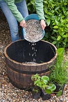 Creating a water feature - adding gravel to base of wooden barrel