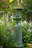 Empty urn with Foxgloves at Moleshill house, Surrey 
