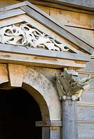 Detail of temple building on the upper terrace of the Collector Earl's Garden designed by Julian and Isabel Bannerman, made from oak and featuring deer antlers found in Sussex parkland.