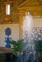 Interior of Oberon's Palace, based on a design by Inigo Jones, encrusted with shell work and with a stalagmite fountain supporting a golden coronet on its jet of water. Collector Earl's Garden designed by Julian and Isabel Bannerman. 