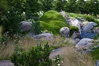 The Swiss Alpine Garden. Water and rocky outcrops evoke the Swiss alpine landscape with plants that thrive in meadow and scree.