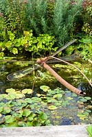 Rusty metal dragonfly sculpture - Brook Hall Cottages, Essex NGS
 