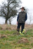 Mike Byford at Hazles Cross Farm in his fields where he grows hellebores for his own delight.