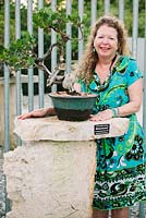 Miriam Charles, horticulturist, with a bonsai trained by her mother since 1978 - Heathcote Botanical Gardens, Florida
