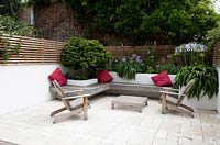 shepherds bush london grey contemporary seats seating patios paved paving wooden fences fencing terraces cushions green shrubs urban red 