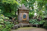 The Temple of Worthies in the Stumpery with a bronze relief of The Queen Mother in the centre. Highgrove Garden, August 2007. 