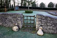 The Gate from The Orchard Room with gold coloured Apple and Pear sculptures, Highgrove Garden, December 2008. 
