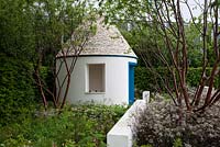 The RBC Blue Water Garden. A trulli building with conical drystone roof. 
