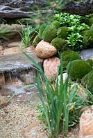 Moss mounds and decorative pebble waterfall in a traditional Japanese garden in the Satoyama district, Satoyama Life - Artisan Garden