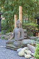 Buddha statue in Oriental style garden 