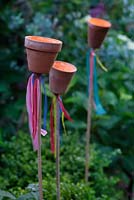 Garden tealight holders on bamboo canes 