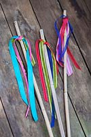Making garden tealight holders - Tie colourful lengths of ribbon around the elastic bands