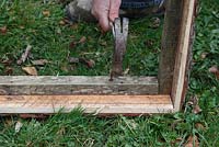 Making a garden sieve - nailing the sieve supports to the frame