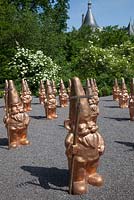 An army of golden garden gnomes with rakes, Festival International des Jardins, Chaumont sur Loire, 2012
'Liberte, Egalite, Fraternite' and it was designed by Sim Flemons and John Warland.  
