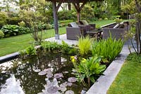 Seating area by the rectangular pond.