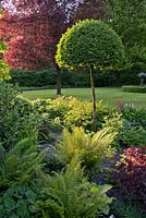 Spring borders with perennials, ferns and topiary, De Romantische tuin - The Romanic Garden of Dina Deferme and Tony Pirotte