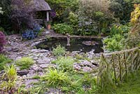 Circular pond surrounded with borders, Wyckhurst Kent