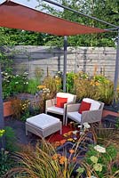 Sunken seating area in urban garden with shade structure, The Landform graden, Hampton Court Palace flower show 2012