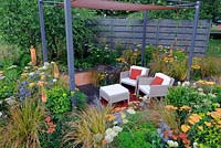 Sunken seating area in urban garden with shade structure, 'The Landform graden', Hampton Court Palace flower show 2012