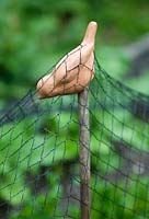 Bird shaped cane topper and netting