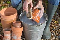 Washing pots to sterilise for following year