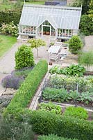 Overview of vegetable garden edged with Buxus hedge. 