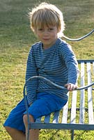 Boy on garden bench - Wood Farm, June