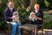Val and Gavin Robbins, owners and makers of the garden with their dogs Dot and Daisy