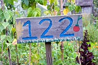 Hand painted allotment plot number 122 sign, Golf Course Allotments, London Borough of Haringey