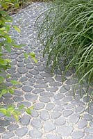 Stone paved path in garden designed by Jacqueline Volker at the Garden festival at Appeltern.