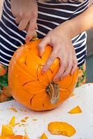 Carving and decorating pumpkins at the pumpkin festival of Asten
