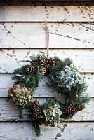 Wreath made from pine cones and hydrangeas