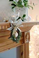 Step-by-step -  Rosemary covered wreath - added gold bauble and ribbon for Christmas decoration hanging on mantelpiece 