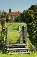 Rustic gate and steps to garden