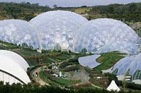 The Eden Project, St Austell, Cornwall, UK. April. View of the Humid Biome and middle of the project from the Visitor Cantre.