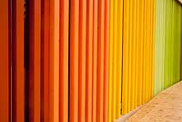 Wooden rainbow fence with decking on Spanish pavilion 