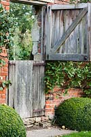 Wooden gate. Sarah Price's garden design in Garsington.