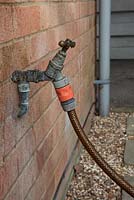 External tap, with hosepipe connected, Gardena type connection