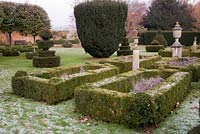 Formal Italianate Topiary Garden with statues in winter - The Old Rectory, Surrey