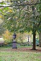 Chilstone Longleat Urn and Pedestal amongst autumn foliage - Marle Place, Kent